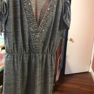 Gray dress with decorative studs.